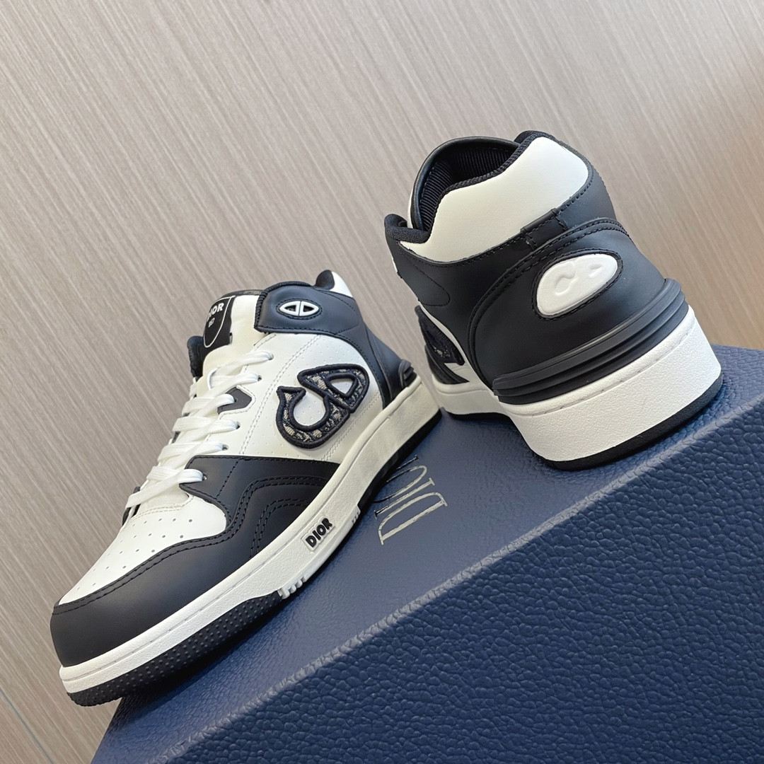ua D*or b57 mid-top sneaker black and white